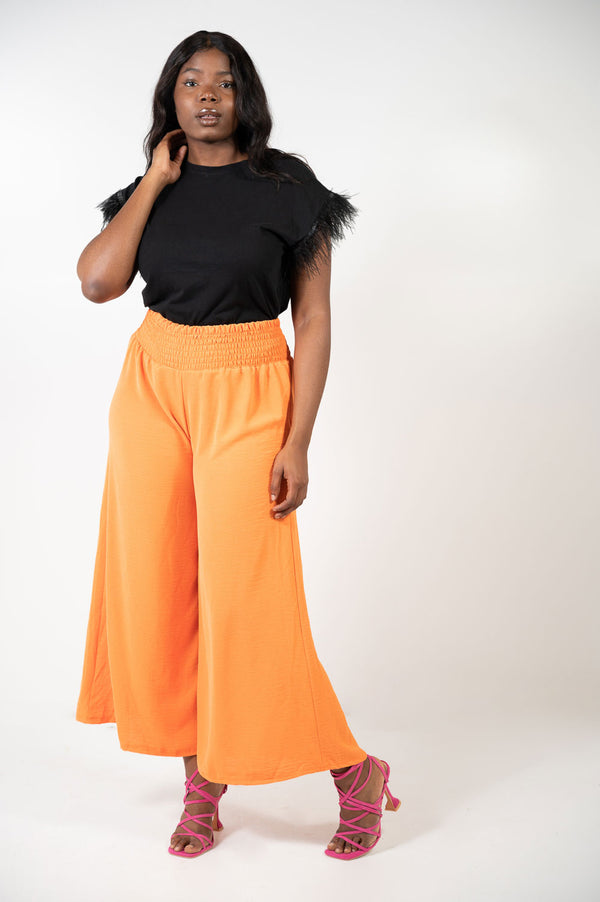 Pantalon elasticum naranja